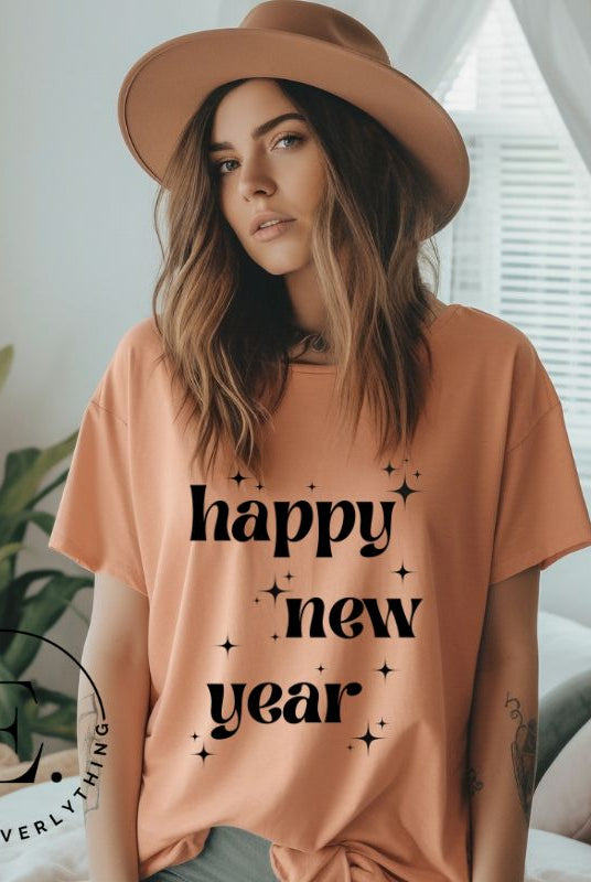 Ring in the New Year with our stunning Happy New Year shirt featuring captivating modern star designs on a peach shirt. 