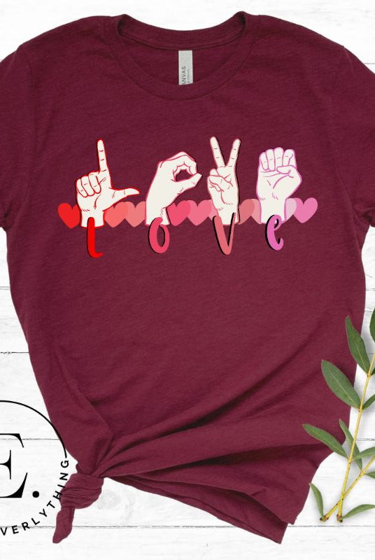 Express love in a visually stunning way with our downloadable PNG sublimation t-shirt design! Featuring American Sign Language (ASL) hands spelling 'Love' with hearts running through them on a maroon shirt. 