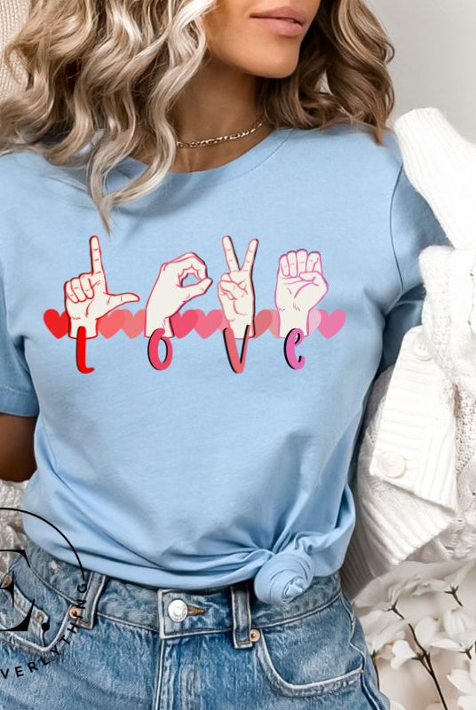 Express love in a visually stunning way with our downloadable PNG sublimation t-shirt design! Featuring American Sign Language (ASL) hands spelling 'Love' with hearts running through them on a blue shirt
