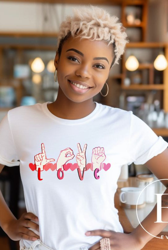 Express love in a visually stunning way with our downloadable PNG sublimation t-shirt design! Featuring American Sign Language (ASL) hands spelling 'Love' with hearts running through them on a white shirt. 