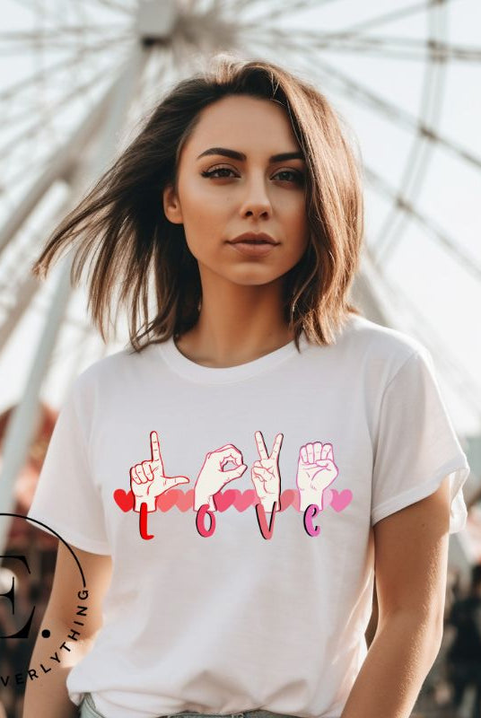Beautiful ASL hand gesture spelling out love with hearts on a white colored shirt.