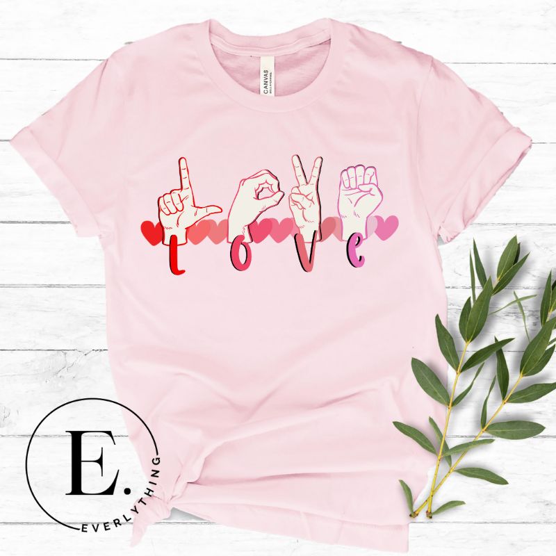 Express love in a visually stunning way with our downloadable PNG sublimation t-shirt design! Featuring American Sign Language (ASL) hands spelling 'Love' with hearts running through them on a pink shirt. 