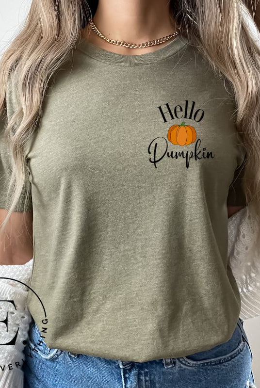 Say hello to autumn with our adorable t-shirt. It features a pumpkin on the front pocket and the playful phrase 'Hello Pumpkin,' this design captures the spirit of the season on a green shirt. 
