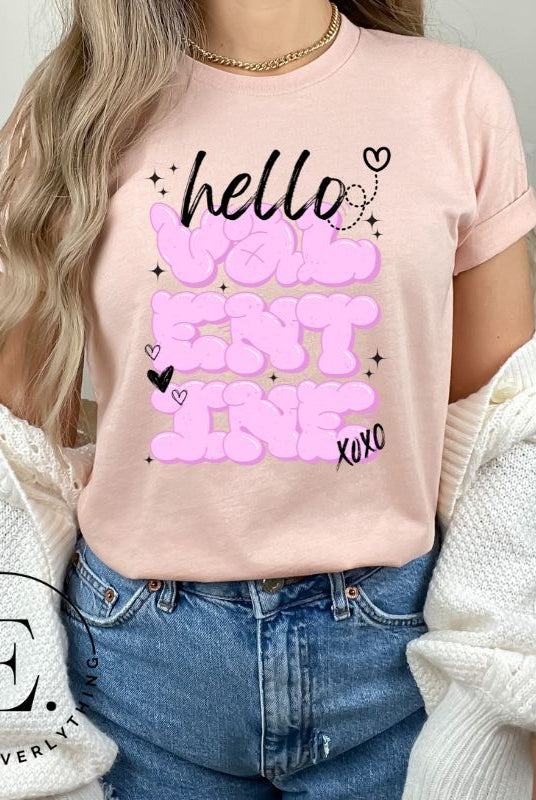 Make a bold statement this Valentine's Day with our street-style graffiti tee! Featuring "Hello Valentine" In eye-catching bubble lettering, on a soft cream shirt. 