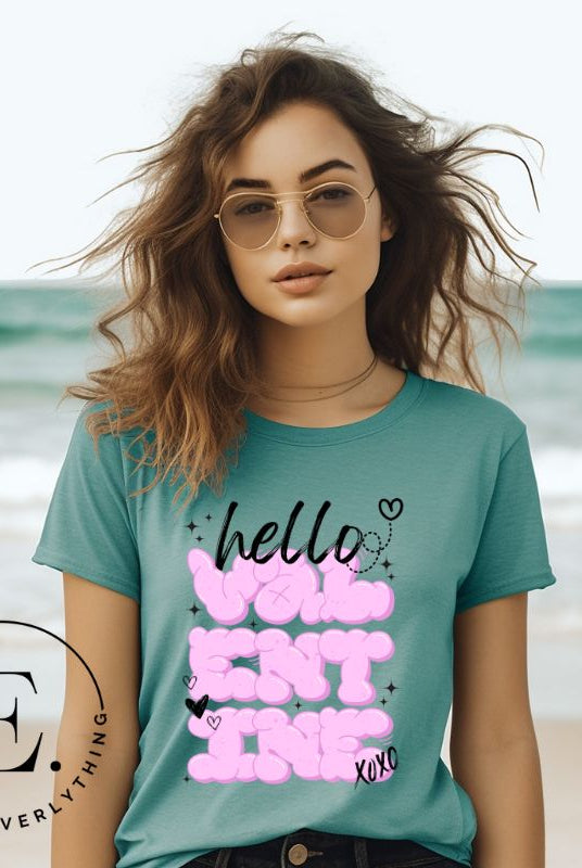 Make a bold statement this Valentine's Day with our street-style graffiti tee! Featuring "Hello Valentine" In eye-catching bubble lettering, on a teal shirt. 