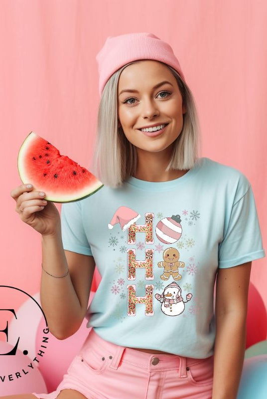 Add a whimsical touch to your holiday wardrobe with our gingerbread "Ho Ho Ho" Christmas shirt on a prism ice blue colored shirt.