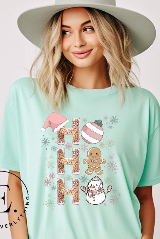 Add a whimsical touch to your holiday wardrobe with our gingerbread "Ho Ho Ho" Christmas shirt on a mint colored shirt.