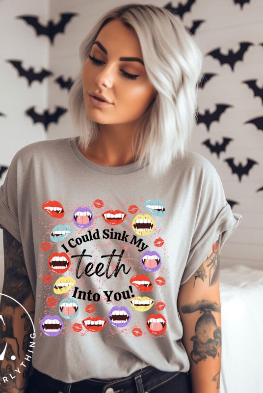 Sink your teeth into Halloween style with our vampire lips shirt. Adorned with a collection of seductive vampire lips, this shirt mesmerizes with its allure. The cheeky message, 'I could sink my teeth into you,' adds a playful twist on a grey shirt. 