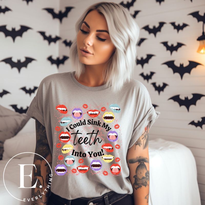 Sink your teeth into Halloween style with our vampire lips shirt. Adorned with a collection of seductive vampire lips, this shirt mesmerizes with its allure. The cheeky message, 'I could sink my teeth into you,' adds a playful twist on a grey shirt. 