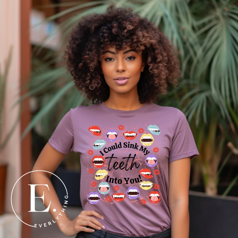 Sink your teeth into Halloween style with our vampire lips shirt. Adorned with a collection of seductive vampire lips, this shirt mesmerizes with its allure. The cheeky message, 'I could sink my teeth into you,' adds a playful twist on a purple shirt. 