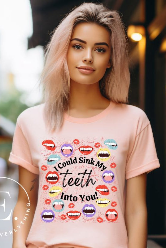 Sink your teeth into Halloween style with our vampire lips shirt. Adorned with a collection of seductive vampire lips, this shirt mesmerizes with its allure. The cheeky message, 'I could sink my teeth into you,' adds a playful twist on a pink shirt. 