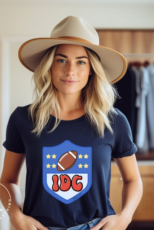 Elevate your game day vibe with our Bella Canvas 3001 unisex tee featuring a cheeky NFL logo design with the letters IDC in place of NFL- because sometimes, we just don't care who wins! Show your laid-back fandom and comfy style on this navy shirt. 