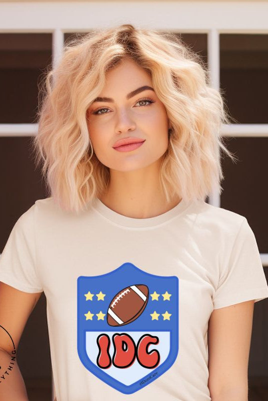 Elevate your game day vibe with our Bella Canvas 3001 unisex tee featuring a cheeky NFL logo design with the letters IDC in place of NFL- because sometimes, we just don't care who wins! Show your laid-back fandom and comfy style on this soft cream shirt. 