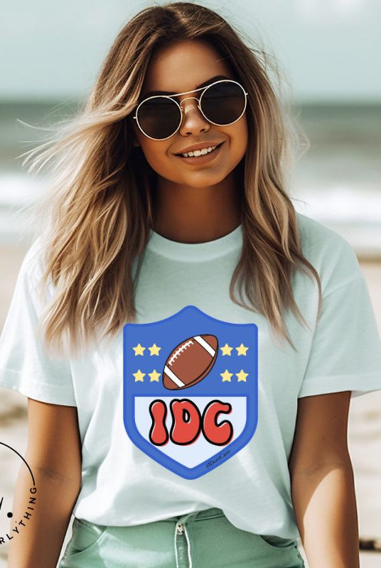 Elevate your game day vibe with our Bella Canvas 3001 unisex tee featuring a cheeky NFL logo design with the letters IDC in place of NFL- because sometimes, we just don't care who wins! Show your laid-back fandom and comfy style on this ice blue shirt. 
