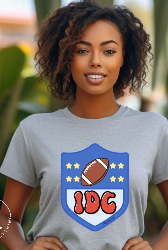 Elevate your game day vibe with our Bella Canvas 3001 unisex tee featuring a cheeky NFL logo design with the letters IDC in place of NFL- because sometimes, we just don't care who wins! Show your laid-back fandom and comfy style on this grey shirt. 