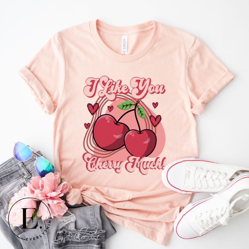 Express your affection with our charming Valentine's Day shirt! Featuring adorable cherries and the sweet message " I Love You Cherry Much," on a peach shirt. 