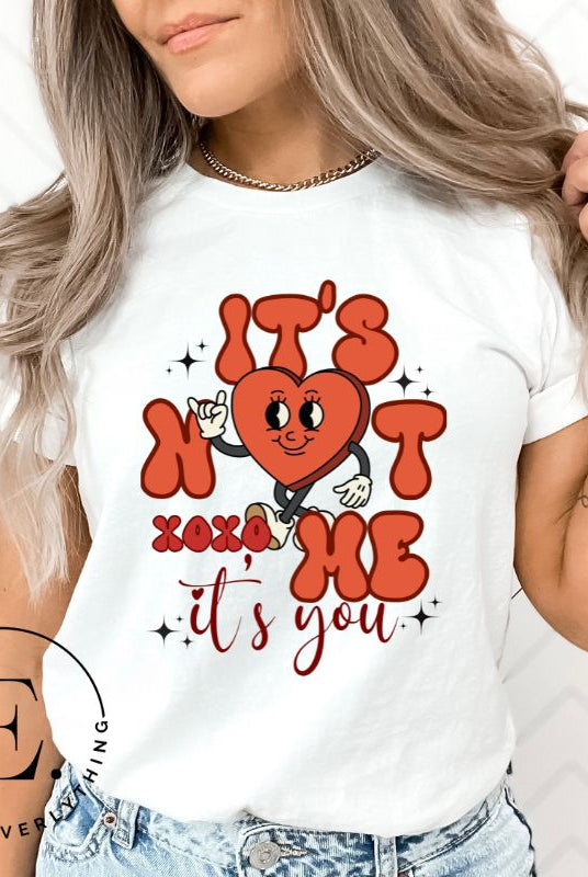 Celebrate Valentine's with our playful shirt! Featuring a bold heart and the message "It's not me, it's you," on a white shirt. 