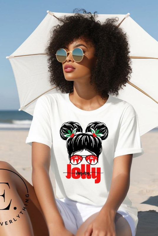 Get into the holiday spirit with our "Jolly Mama" Christmas Shirt! Featuring a stylish mom rocking pigtail buns and festive Christmas Sunglasses on a white colored shirt.