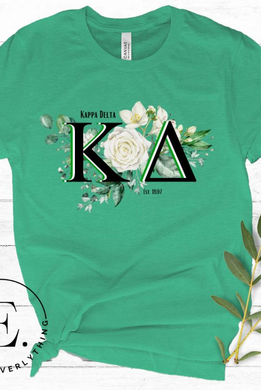 Elevate your Kappa Delta sisterhood with our stunning t-shirt, featuring the sorority letters and the elegant white rose  on a green shirt. 