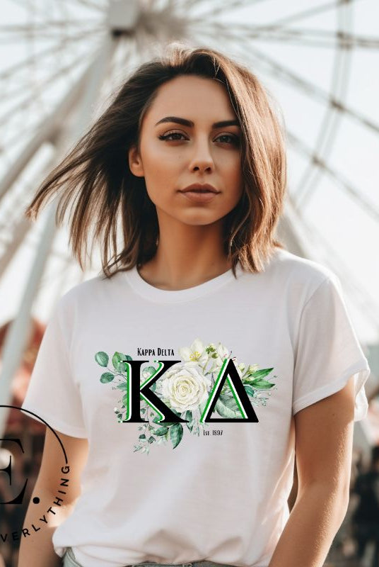 Elevate your Kappa Delta sisterhood with our stunning t-shirt, featuring the sorority letters and the elegant white rose on a white shirt. 
