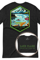 Back view of a black heather Bella + Canvas 3001 unisex shirt featuring a colorful design of Lake Clark National Park with mountains, lake, and wildlife. Inset shows the front view with "Lake Clark National Park | Alaska - 1980" text on a black shirt