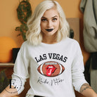 Get ready to support the Las Vegas Raiders in style with our premium sweatshirt, featuring the team's name and iconic slogan, "Raider Nation." On a white sweatshirt. 