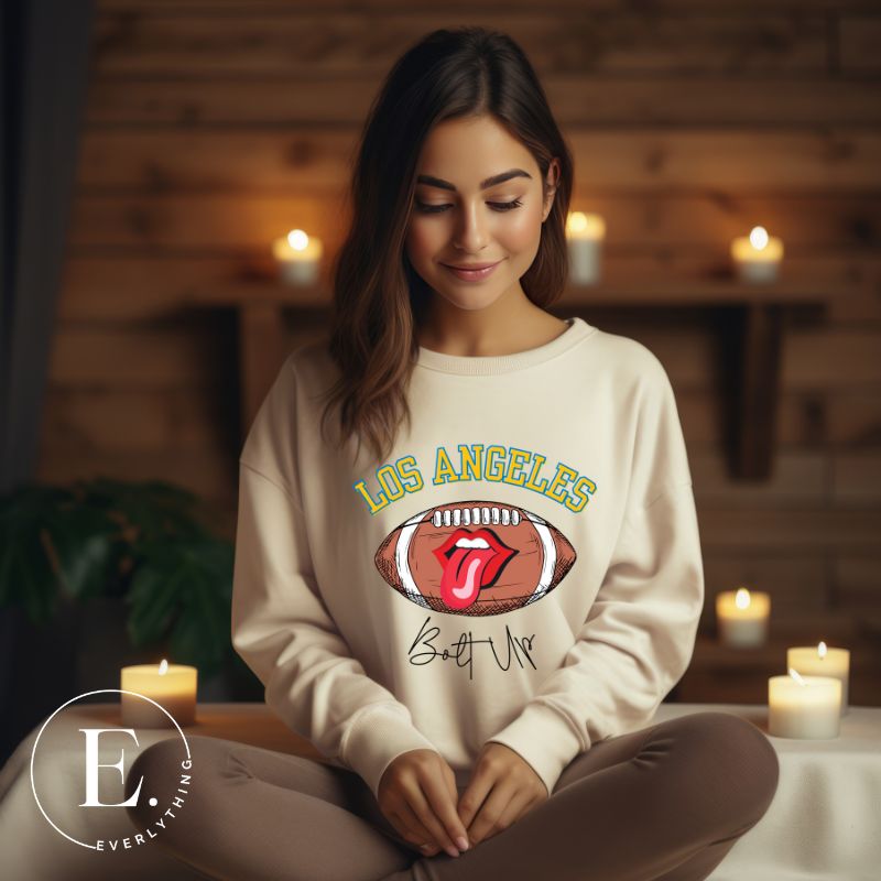 Show off your Los Angeles Chargers pride with our exclusive sweatshirt. It features the team's name and the electrifying slogan "Bolt Up." On a sand colored sweatshirt. 