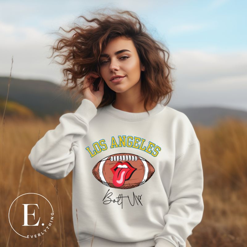 Show off your Los Angeles Chargers pride with our exclusive sweatshirt. It features the team's name and the electrifying slogan "Bolt Up." On a white sweatshirt. 