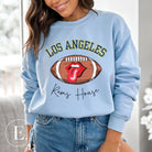 Cheer on the Los Angeles Rams in style with our exclusive sweatshirt featuring the team name and iconic slogan, "Ram House." On a blue sweatshirt. 