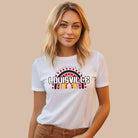 A vibrant rainbow design and the text "Louisville" in bold letters, perfect for showing University of Louisville spirit on a white shirt.