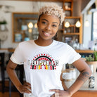 A vibrant rainbow design and the text "Louisville" in bold letters, perfect for showing University of Louisville spirit on a white shirt.