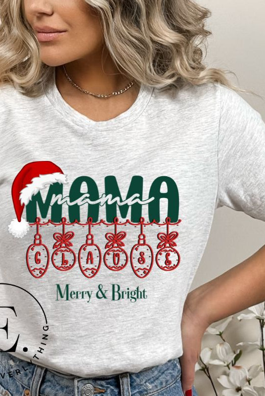 Experience the enchantment of Christmas with our Mama Claus shirt, on a grey colored shirt. 
