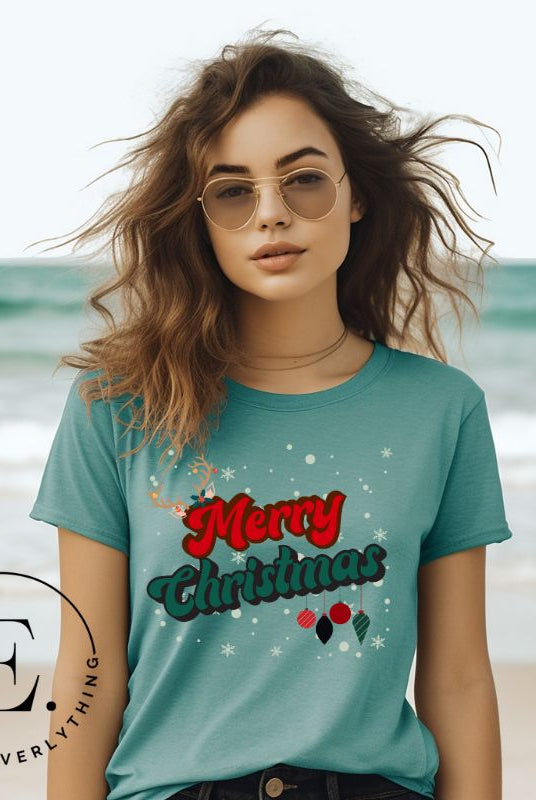 Get ready to take a trip down memory lane with our Merry Christmas retro letters shirt on a teal colored shirt. 