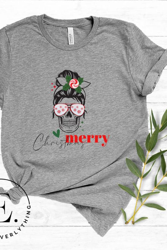 Get into the festive spirit with our Merry Christmas messy bun skull shirt design on a grey colored shirt.