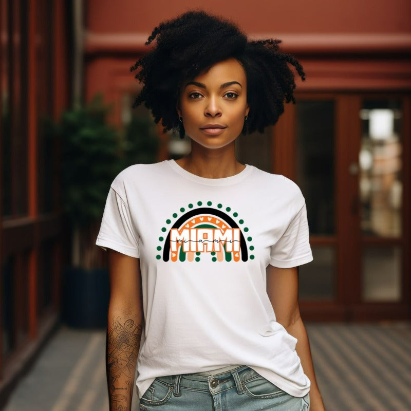 Bella + Canvas 3001 unisex shirt featuring a rainbow design in orange, green, and black with "Miami" text and decorative hearts and dots on a white shirt.