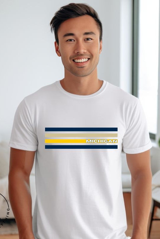 Revive retro collegiate fashion with our Michigan graphic tee. Bosting classic school colors and minimalist design, this men's shirt features distinctive chest stripes with "Michigan" in bold block lettering on a white shirt. 