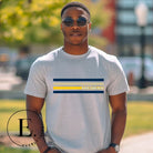 Revive retro collegiate fashion with our Michigan graphic tee. Bosting classic school colors and minimalist design, this men's shirt features distinctive chest stripes with "Michigan" in bold block lettering on a grey shirt. 