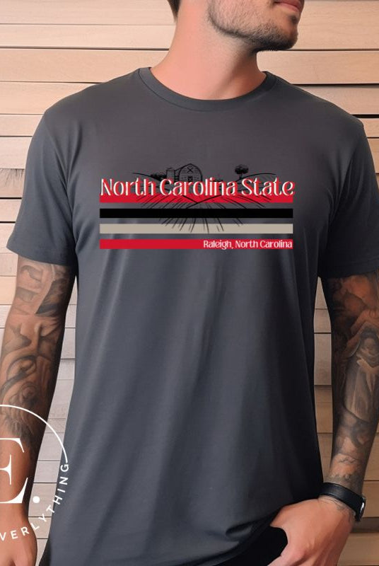 NC State retro-inspired shirt paying homeage to the schools rich history and renowned agricultural programs. Design on a dark grey colored shirt.