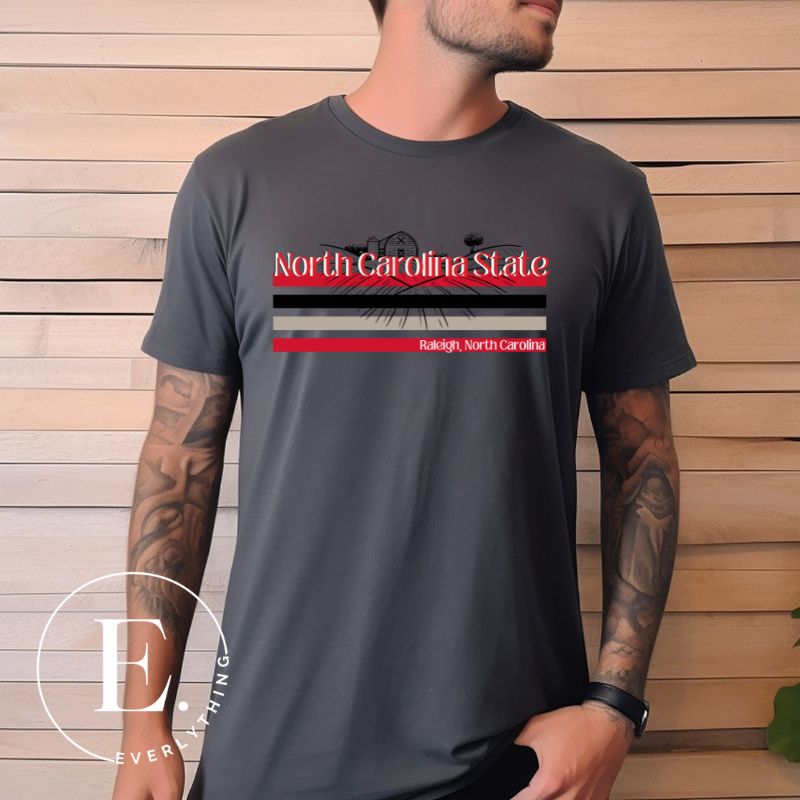 NC State retro-inspired shirt paying homeage to the schools rich history and renowned agricultural programs. Design on a dark grey colored shirt.