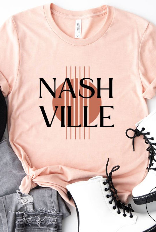 Capture the essence of Nashville with our minimalistic country western T-shirt. Featuring the iconic word "Nashville" with guitar strings silhouette, on ap ink shirt. 