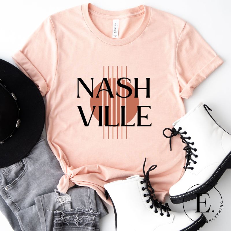 Capture the essence of Nashville with our minimalistic country western T-shirt. Featuring the iconic word "Nashville" with guitar strings silhouette, on ap ink shirt. 