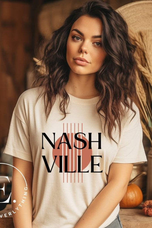 Capture the essence of Nashville with our minimalistic country western T-shirt. Featuring the iconic word "Nashville" with guitar strings silhouette, on a cream shirt. 