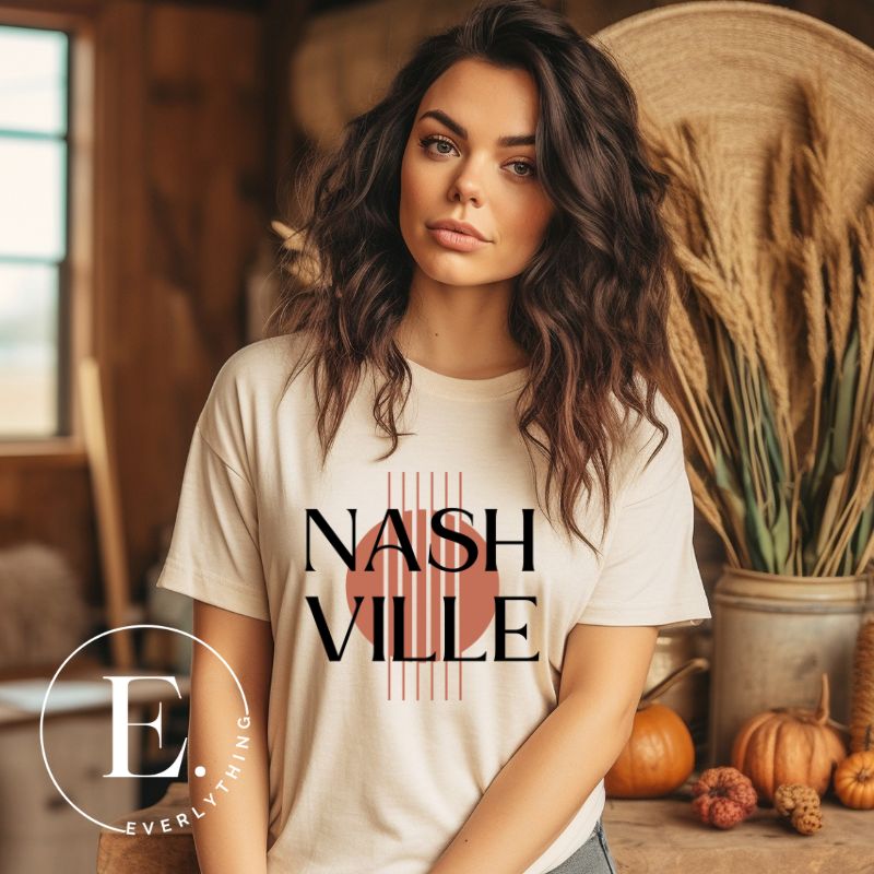 Capture the essence of Nashville with our minimalistic country western T-shirt. Featuring the iconic word "Nashville" with guitar strings silhouette, on a cream shirt. 
