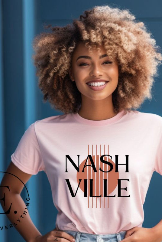 Capture the essence of Nashville with our minimalistic country western T-shirt. Featuring the iconic word "Nashville" with guitar strings silhouette, on a pink shirt. 