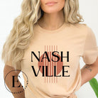 Capture the essence of Nashville with our minimalistic country western T-shirt. Featuring the iconic word "Nashville" with guitar strings silhouette, on a tan shirt. 
