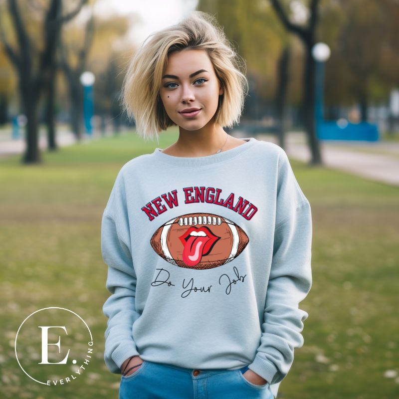 Cheer on the New England team in style with this unique sweatshirt, featuring a football and fun lips and tongue design. Emblazoned with the team's inspiring slogan "Do your Job" and the iconic New England wordmark, this comfortable blue sweatshirt. 
