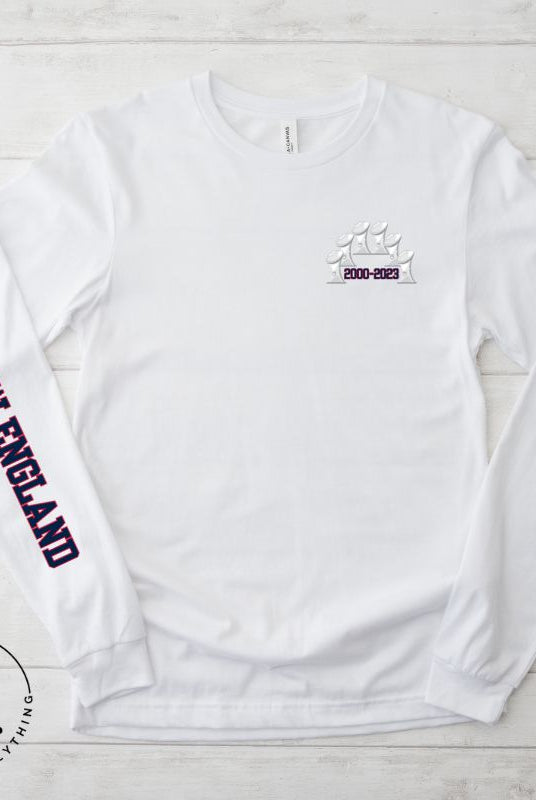 Show your love for the New England Patriots with this stylish graphic long t-shirt featuring 6 football championship trophies. Pay homage to head coach Bill Belichick's tenure (2000-2023) with championship dates and scores on the back, while the front pocket showcases the iconic 6 trophies. The right sleeve proudly displays "New England," celebrating an era of football dominance and what was a dynasty. A must-have for all New England Fans to say thank you to the coaching GOAT.