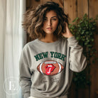 Gear up for game day with this New York Jets sweatshirt, featuring a football and playful lips and tongue design. Emblazoned with the team's rallying cry "Go Jets" and the iconic wordmark New York, on a grey sweatshirt. 