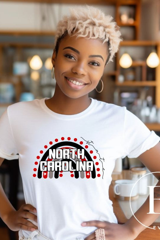 Looking for a way to show off your vibrant spirit? Look no further than this NC State University t-shirt. The NC State colors shine on a boho rainbow backdrop, representing the iconic North Carolina wordmark in a unique and trendy way on a white shirt 
