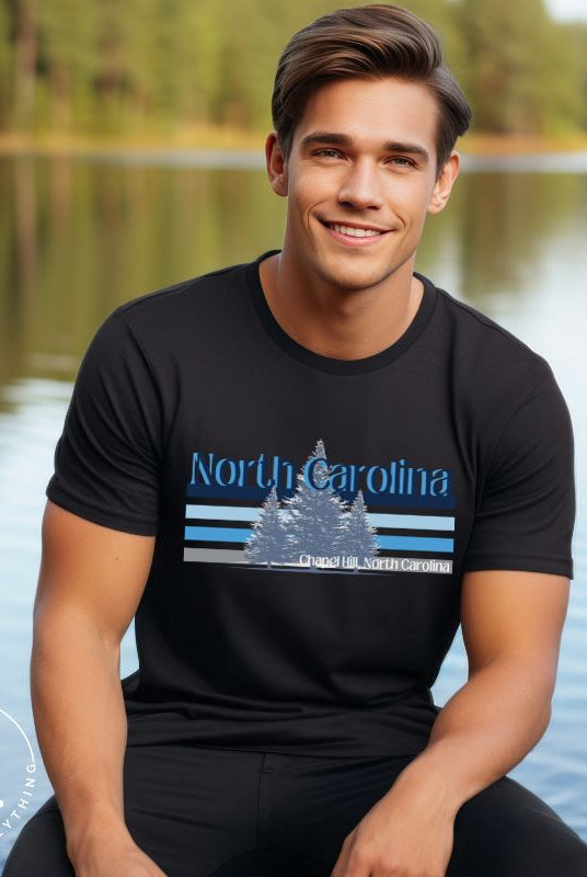 Show your school pride with this iconic North Carolina wordmark t-shirt. Made from premium materials, it features a North Carolina tree line in a the cool Carolina blue colors, representing a tradition of excellence for the nature that North Carolina offers on a black shirt. 